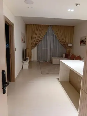 a view of a living room with a couch at The Executive Suite Luxury 1 Bedroom Brand New in Dubai