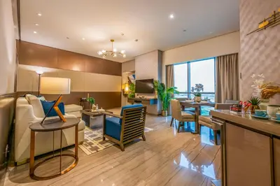 a living room with a couch and a table at City View 1 BR - Creek Heights, Upgraded by UDH in Dubai