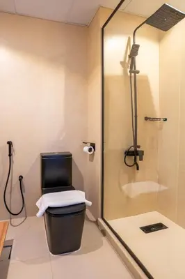 a bathroom with a shower and a toilet with a glass door at Airstay - Upgraded Studio - Near Pool & Metro - Monthly Offer Available! in Dubai