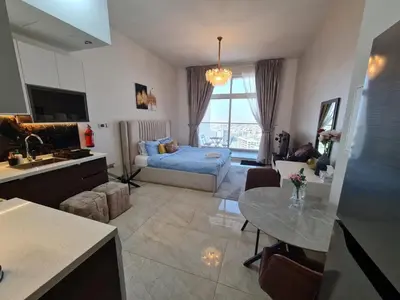 a living room with a couch and a table at Fully Equipped Home near Miracle & Butterfly Gardens in Dubai