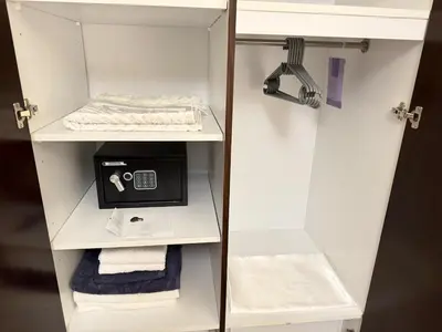 a white cabinet with towels and a scale in it at Burj Khalifa 1BR Pool Gym Sauna Dubai Mall in Dubai