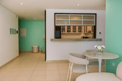 a room with a table and chairs and a window at Burj Khalifa 1BR Pool Gym Sauna Dubai Mall in Dubai