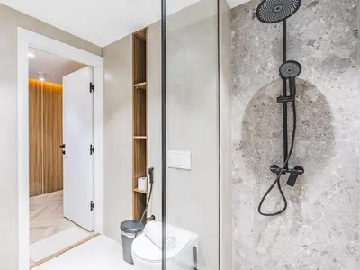 a bathroom with a shower with a toilet in it at Waterfront 1BR- Time Place Dubai Marina-City Views in Dubai