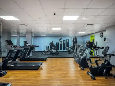a gym with treadmills and elliptical machines at Waterfront 1BR- Time Place Dubai Marina-City Views in Dubai