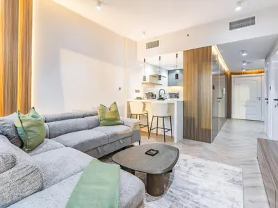a living room with a couch and a table at Waterfront 1BR- Time Place Dubai Marina-City Views in Dubai