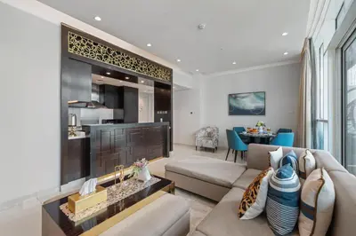 a living room with a couch and a table at Nice 2 Bedroom DAMAC Uppercrest Downtown Near Dubai Mall - Partial Burj Khalifa View in Dubai