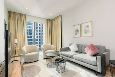 a living room with a couch and chairs at CitiHome Refined 1BR Jumeirah Living Marina Gate in Dubai