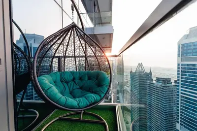 a swing chair on the top of a skyscraper at Top Amenities, Luxury 2BR, 5 min. to Burj Khalifa in Dubai