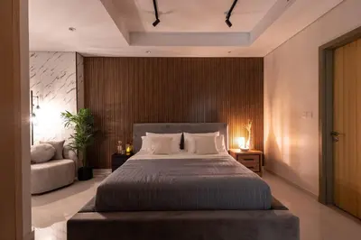 a bedroom with a large bed and a couch at Top Amenities, Luxury 2BR, 5 min. to Burj Khalifa in Dubai