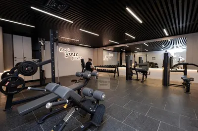 a gym with treadmills and exercise equipment in a room at Luxurious chic getaway for 4, pool view, hammam, sauna, PS5 in Dubai