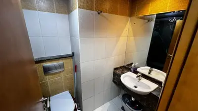 a bathroom with a sink and a toilet at Dream home in Dubai