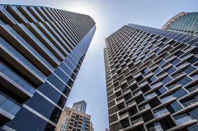 two tall buildings standing next to each other at 3BR with Full Burj Khalifa and Dubai Fountain View at Address Opera in Dubai