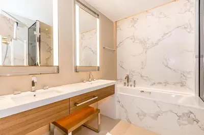 a bathroom with a tub and a sink and a shower at 3BR with Full Burj Khalifa and Dubai Fountain View at Address Opera in Dubai