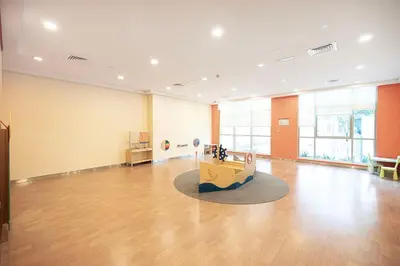a large room with a table in the middle of it at Boulevard Chic Modern 2BR with Iconic Street Views in Dubai