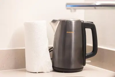 a coffee pot and a roll of toilet paper on a counter at Heart of Downtown Stylish 2BR at Vida Dubai Mall in Dubai