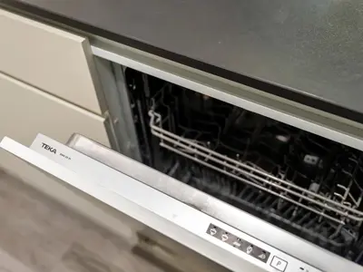 an oven with its door open in a kitchen at Royal Vista - 1BR with Darts Wall at Belgravia Square JVC in Dubai