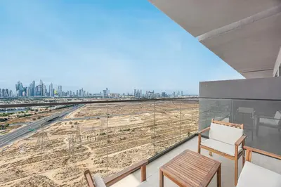 a balcony with a view of a city at Daniels Chic 1BR with City Skyline Views at JVC in Dubai