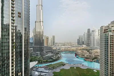 an aerial view of a city with tall buildings at Luxury 4BR Apartment Burj Khalifa & Mall Views in Dubai