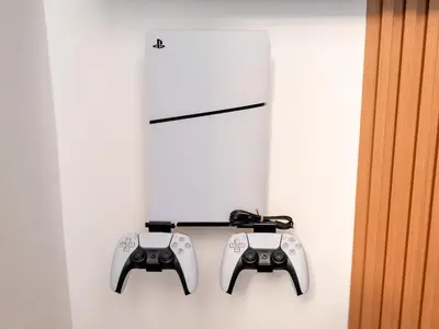 two video game controllers hanging on a wall at Ultra Stylish Luxury Flat w Harbour View in Dubai Marina, Sleeps 10 pax in Dubai