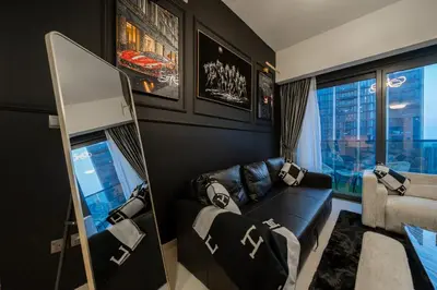 a living room with a couch and a window at Noir x DXB a High Floor 1BDR in Downtown Dubai in Dubai