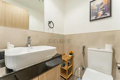 a bathroom with a sink and a toilet at Well-Connected, Family-Friendly Community with Resort-Style Amenities, Minutes from Major Malls and Al Maktoum International Airport - Damac Hills 2 Amargo, Damac Hills 2 by Deluxe Holiday Homes in Dubai