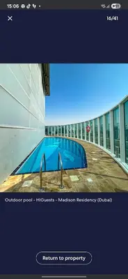 a picture of a swimming pool in a building at Lovely cozy studio in Tecom near Metro in Dubai