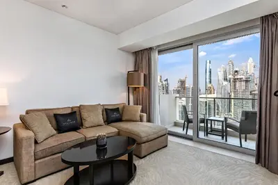 a living room with a couch and a large window at Marriott 1BR Apartment with Dubai Marina View in Dubai