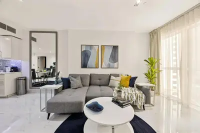 a living room with a couch and a table at Ahlan Marhaba Marina JBR in Dubai