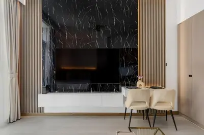 a dining room with a large window with a table and chairs at Stylish Missoni Studio with Direct Pool Access in Dubai