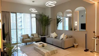 a living room with a couch and a table at Boulevard Sea View Luxury 1 BR Next Dubai Mall in Dubai