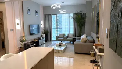 a large living room with a couch and a living room at Boulevard Sea View Luxury 1 BR Next Dubai Mall in Dubai