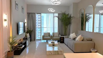 a living room with a couch and a table at Boulevard Sea View Luxury 1 BR Next Dubai Mall in Dubai