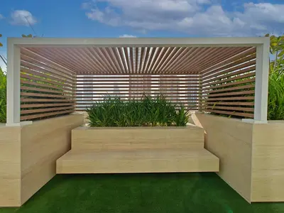a garden with a wooden fence and some plants at Brand New High Floor 1 BR with city view, pool and gym in Dubai