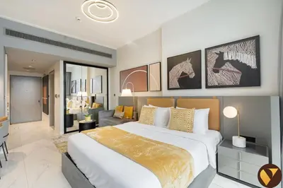 a bedroom with a large bed and a living room at Vogue Downtown Mag 318 near Burj Khalifa and Dubai Mall, Studio Apartment with Balcony, Canal and City Skyline View, Access to all Amenities in Dubai
