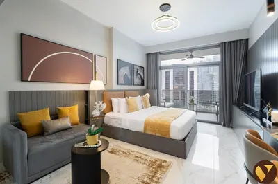 a bedroom with a king sized bed and a couch at Vogue Downtown Mag 318 near Burj Khalifa and Dubai Mall, Studio Apartment with Balcony, Canal and City Skyline View, Access to all Amenities in Dubai