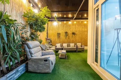 a living room with a couch and a chair at 3-Bedroom Cozy Townhouse with great amenities in Dubai in Dubai