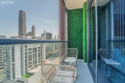 a balcony with a view of a city at Near Museum of the Future - Homey Apartment-Jumeirah Garden in Dubai