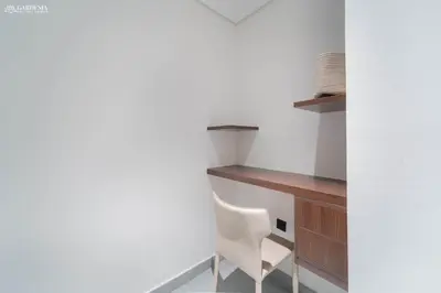 a room with a desk and a white chair at Near Museum of the Future - Homey Apartment-Jumeirah Garden in Dubai