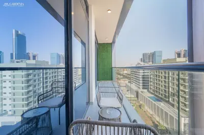 a balcony with benches and a view of the city at Near Museum of the Future - Homey Apartment-Jumeirah Garden in Dubai