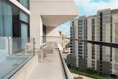 a balcony with a view of some buildings at Luxury Binghatti Phantom Suites By Hostiva in Dubai