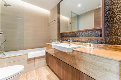 a bathroom with two sinks and a bath tub and a sink at Burj Khalifa View, Easy Access to Dubai Mall and Burj Khalifa - Imperial Avenue, Downtown Dubai by Deluxe Holiday Homes in Dubai