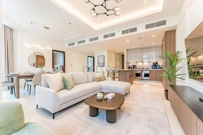 a living room with a couch and a table at Burj Khalifa View, Easy Access to Dubai Mall and Burj Khalifa - Imperial Avenue, Downtown Dubai by Deluxe Holiday Homes in Dubai