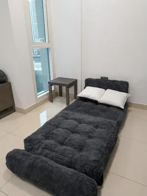 a bed sitting on the floor in a room at Superb Marina Views, Entire 1BR Apartment - Atlantic Towers next to Marina Mall in Dubai