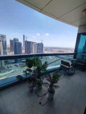 a balcony with potted plants and a view of a city at Spacious Master Bedroom with Balcony Horizon Tower, Dubai Marina in Dubai