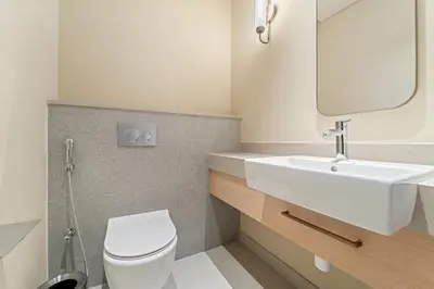 a bathroom with a white toilet and a sink at Vida Residences Dubai Mall Spacious 1BR Apartment in Dubai