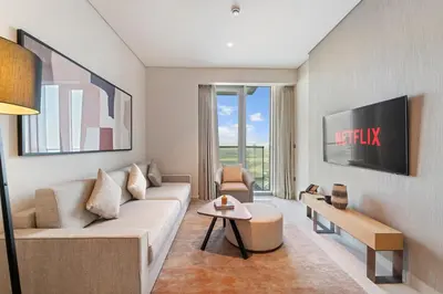 a living room with a couch and a table at Vida Residences Dubai Mall Spacious 1BR Apartment in Dubai