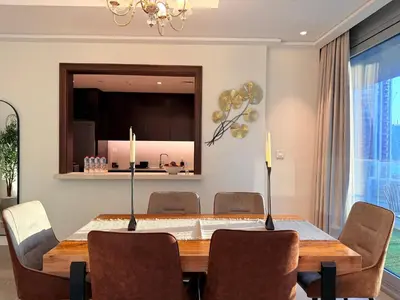 a dining room with a table and chairs at Urban Luxury Burj Vista Apartments Direct Burj Khalifa View in Dubai