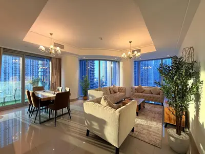 a living room with a couch and a table at Urban Luxury Burj Vista Apartments Direct Burj Khalifa View in Dubai