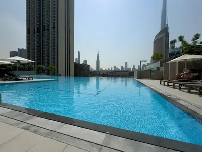 a large swimming pool on the roof of a building at Urban Luxury Burj Vista Apartments Direct Burj Khalifa View in Dubai