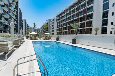 a swimming pool in the middle of a building at Luxury Studio in the Heart of Meydan in Dubai